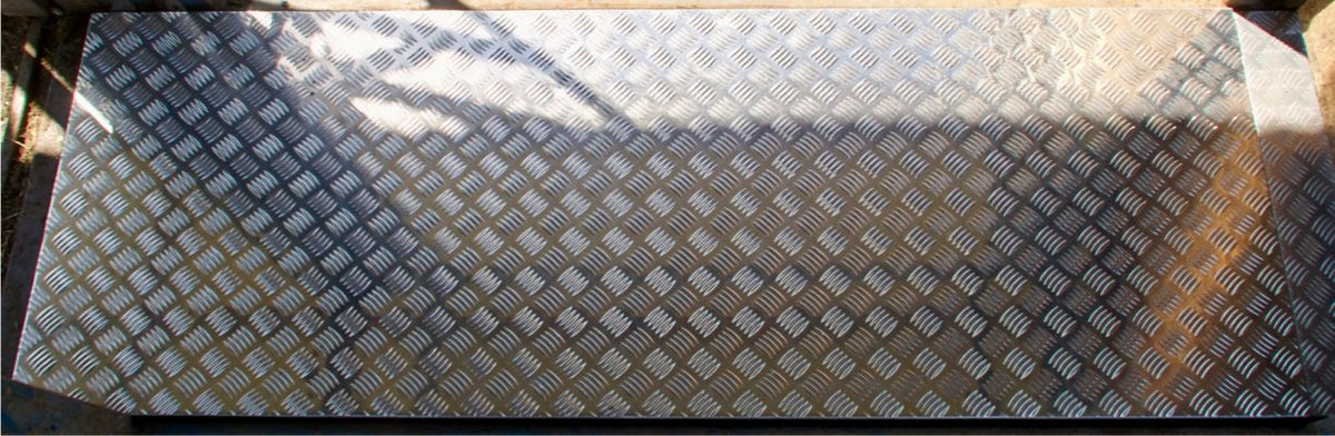 Aluminium tread plate platform secured in position
